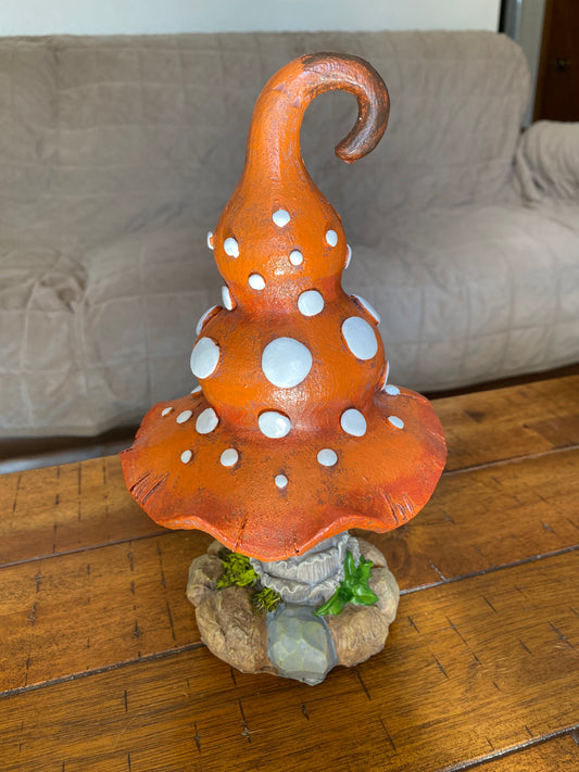 Orange mushroom figure with white spots