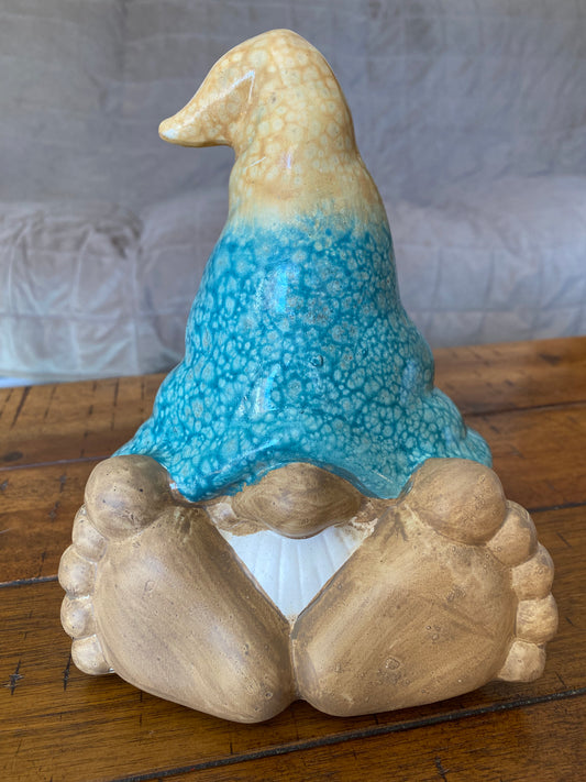 7.25 inch gnome with tan and blue hat, small nose, and large feet