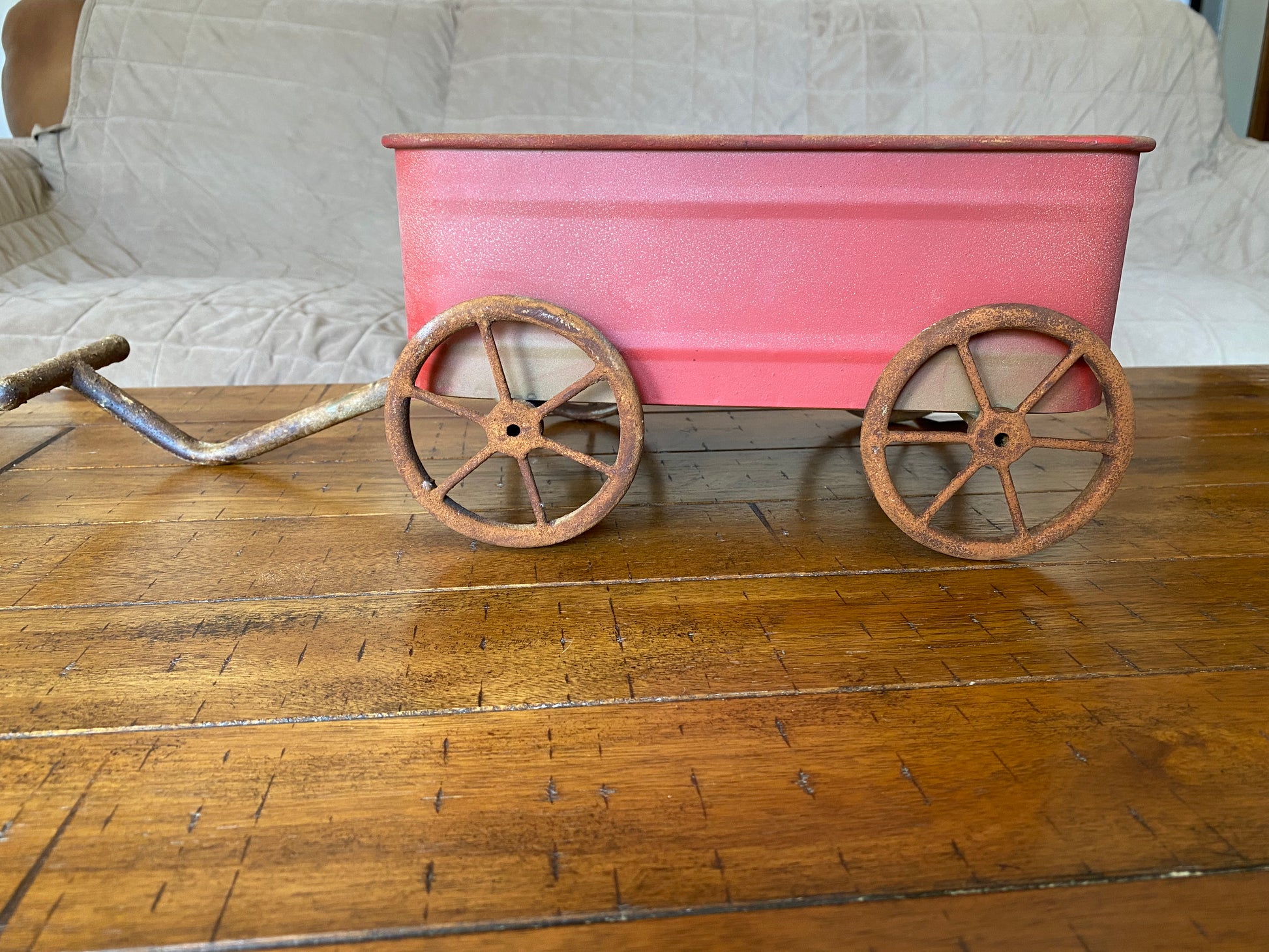 Rustic red wagon with rusted wheels